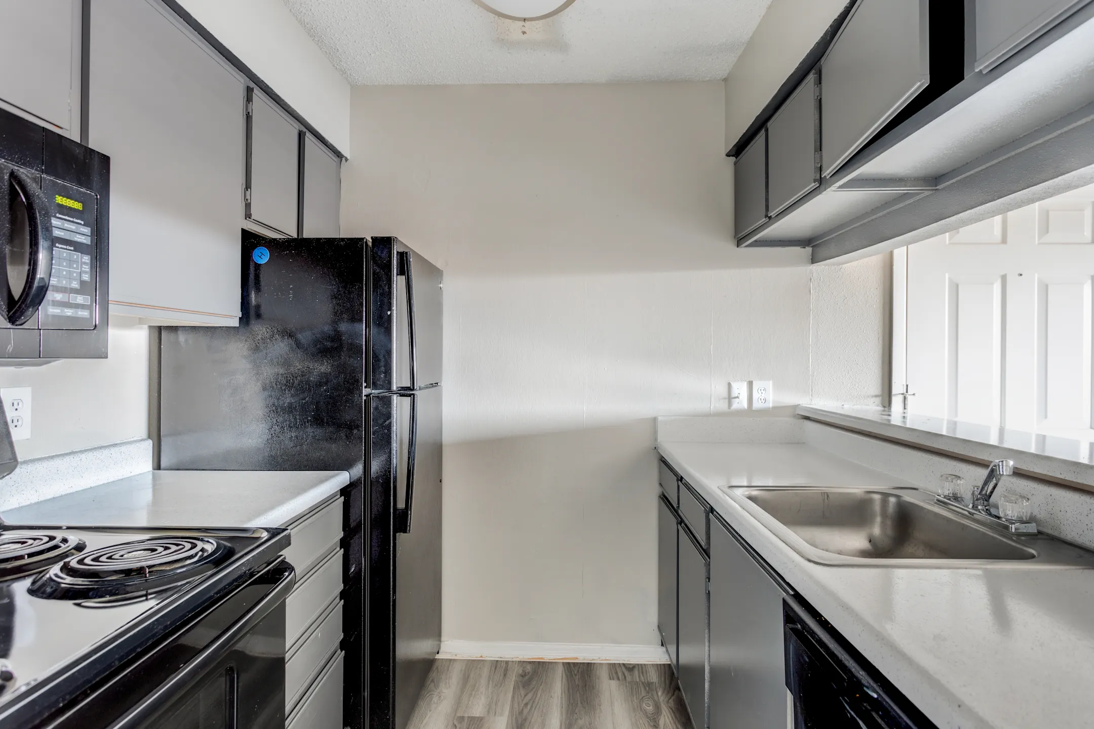 Kitchen - Peppermill Apartments - Universal City, TX