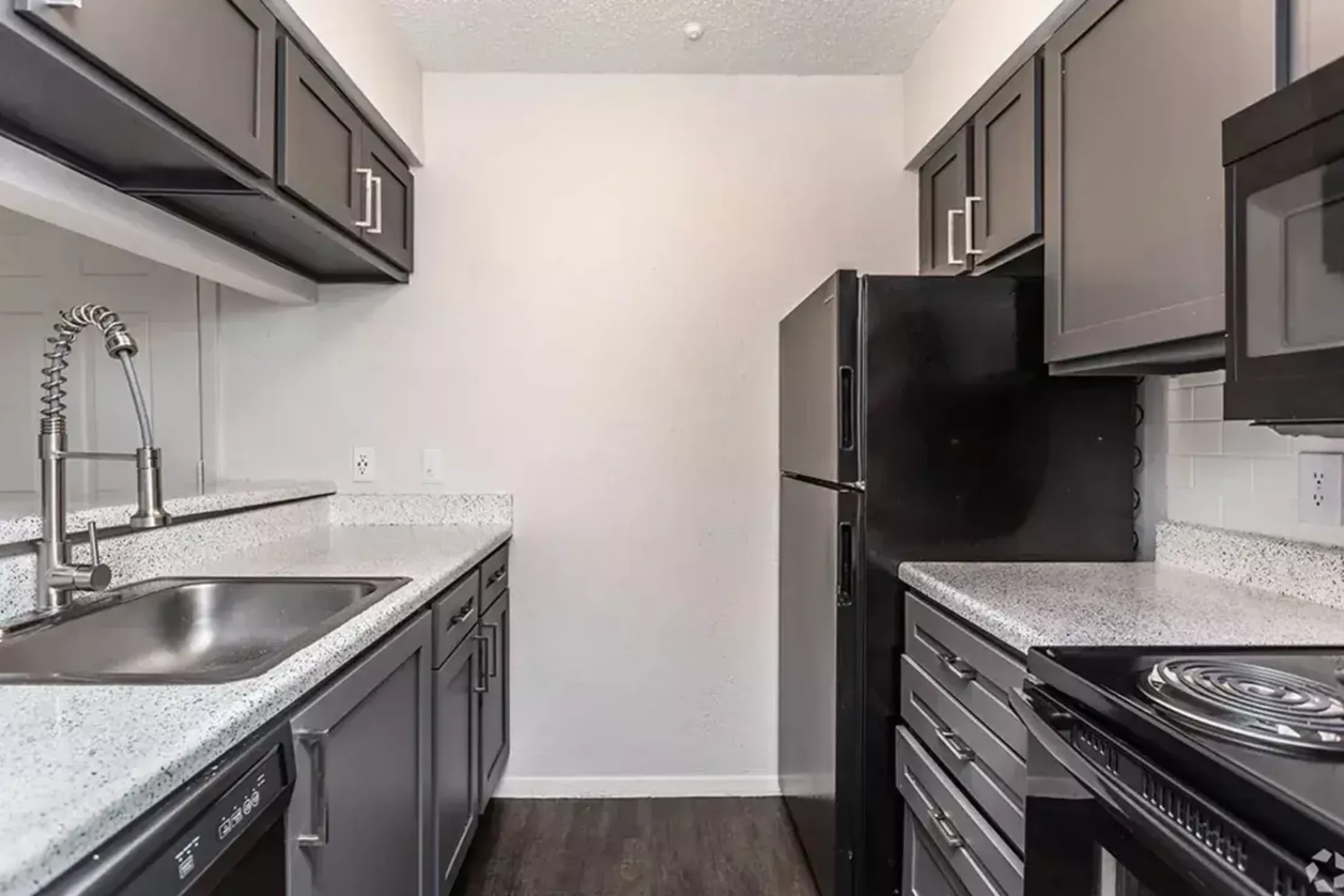 Kitchen - Peppermill Apartments - Universal City, TX