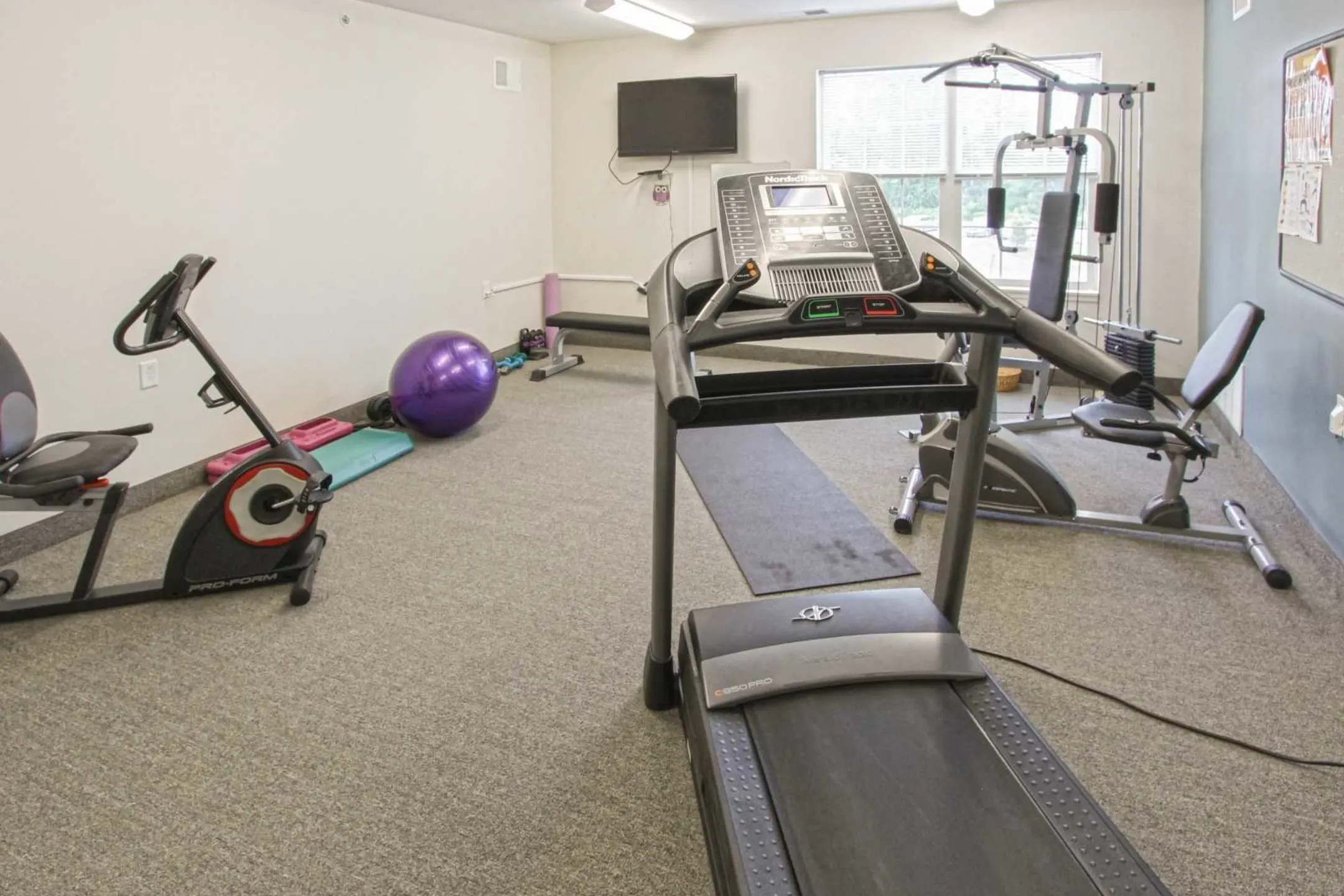 Fitness Weight Room - New Hartford Square Senior Apartments - Whitesboro, NY