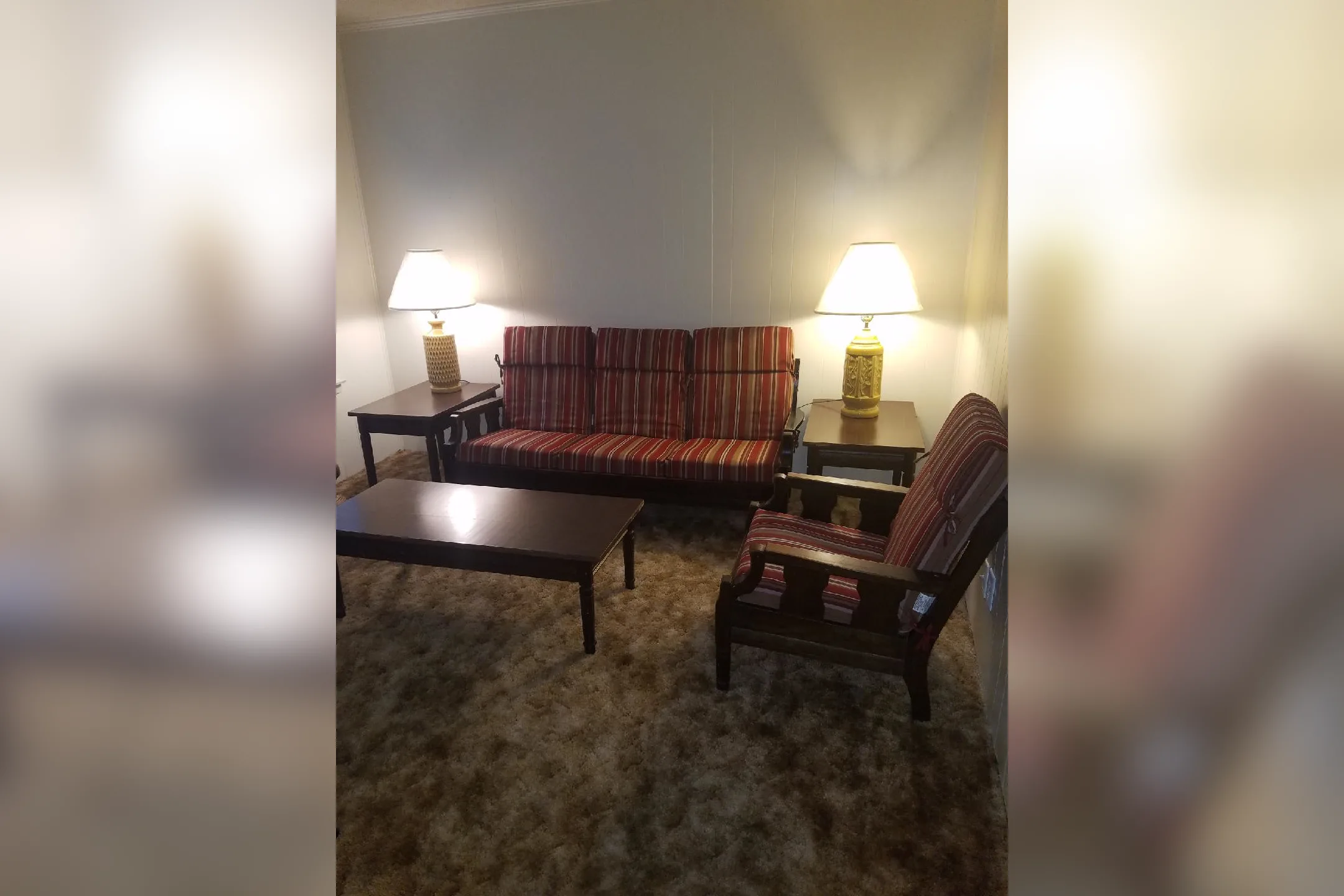 Living Room - Whispering Oaks Apartments - Waco, TX