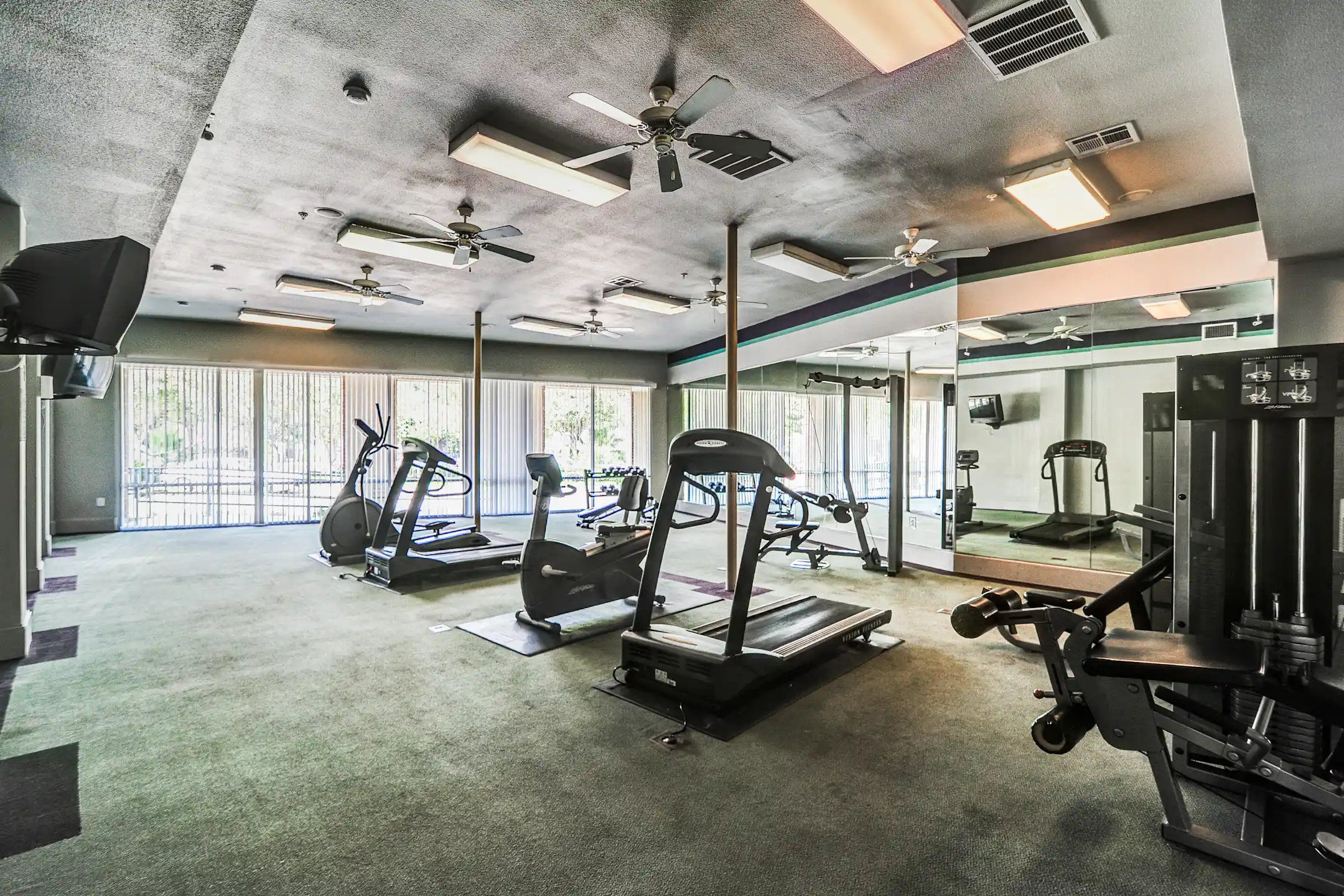 Fitness Weight Room - Refugio Place Apartment Homes - San Antonio, TX