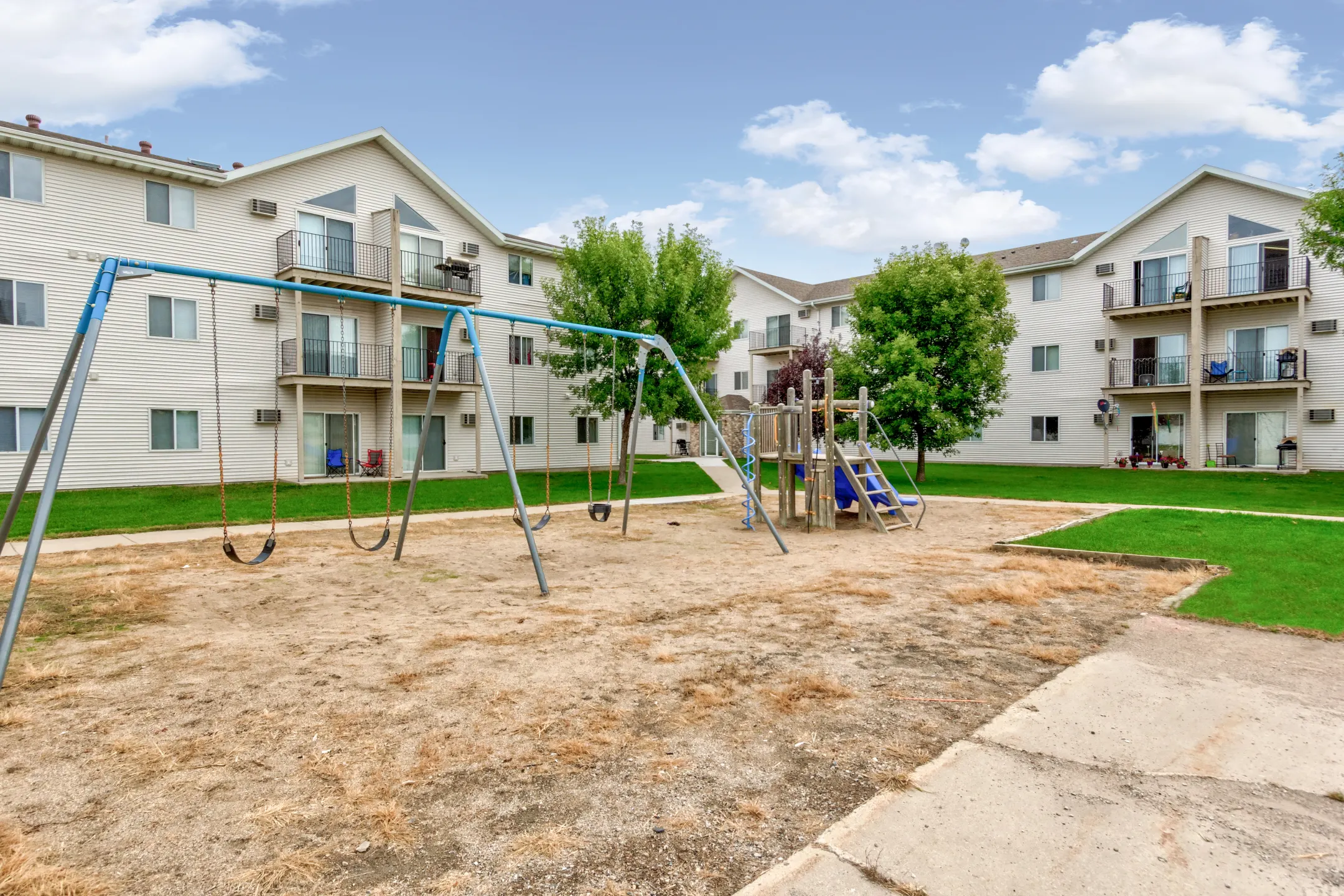 Playground - Wheatland Place Apartments & Townhomes - Fargo, ND