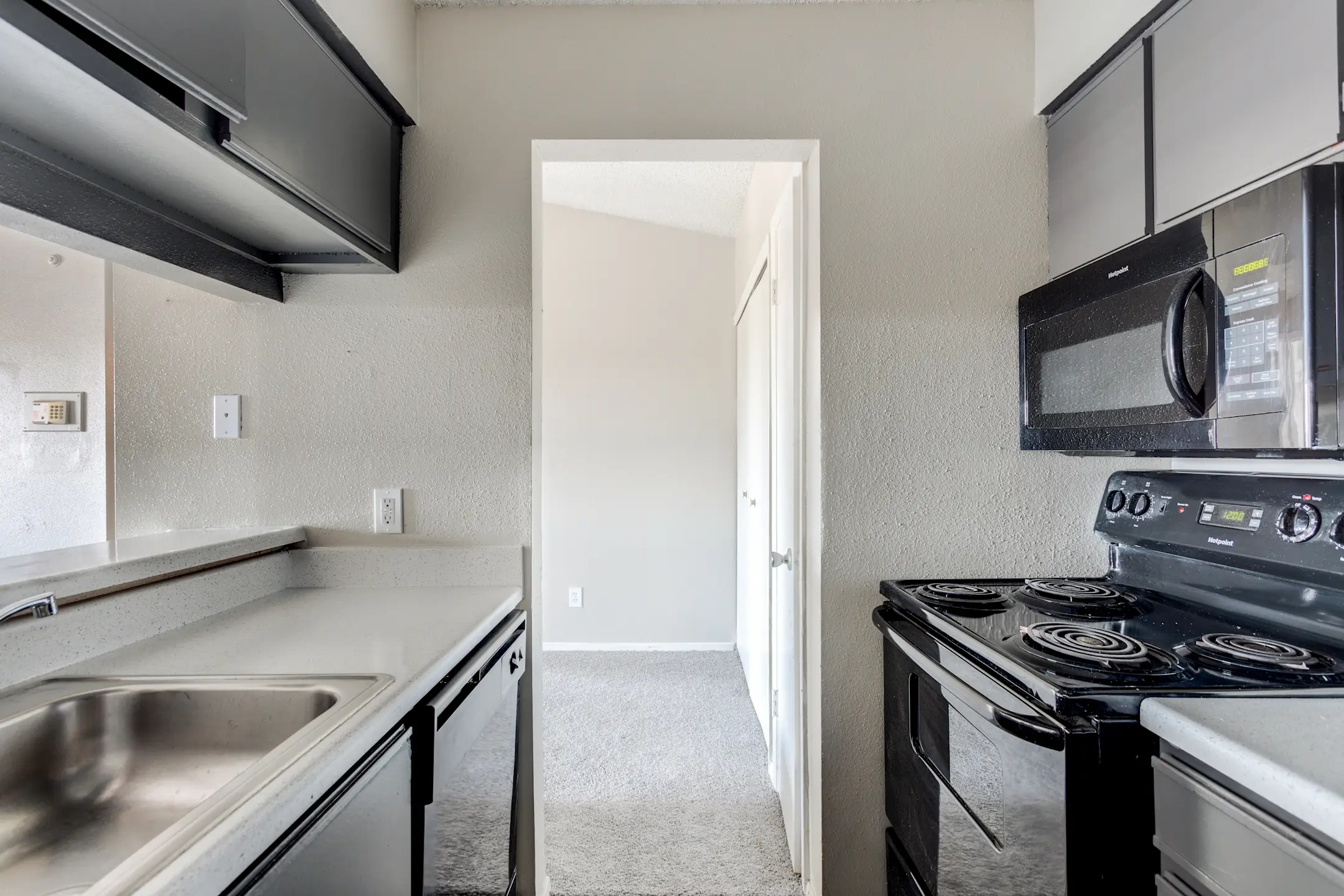 Kitchen - Peppermill Apartments - Universal City, TX