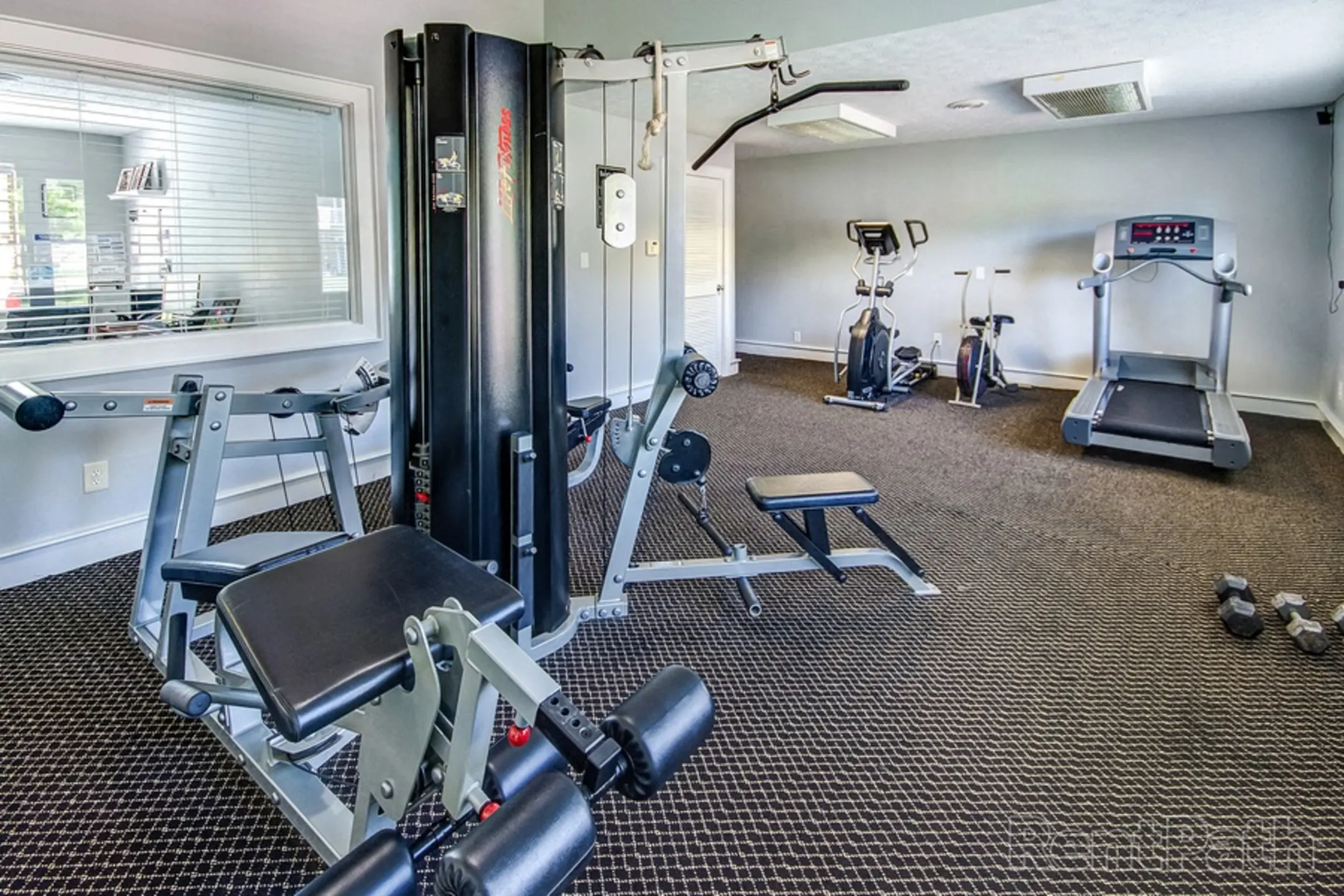 Fitness Weight Room - The Village at Sandstone Apartments - Greenwood, IN