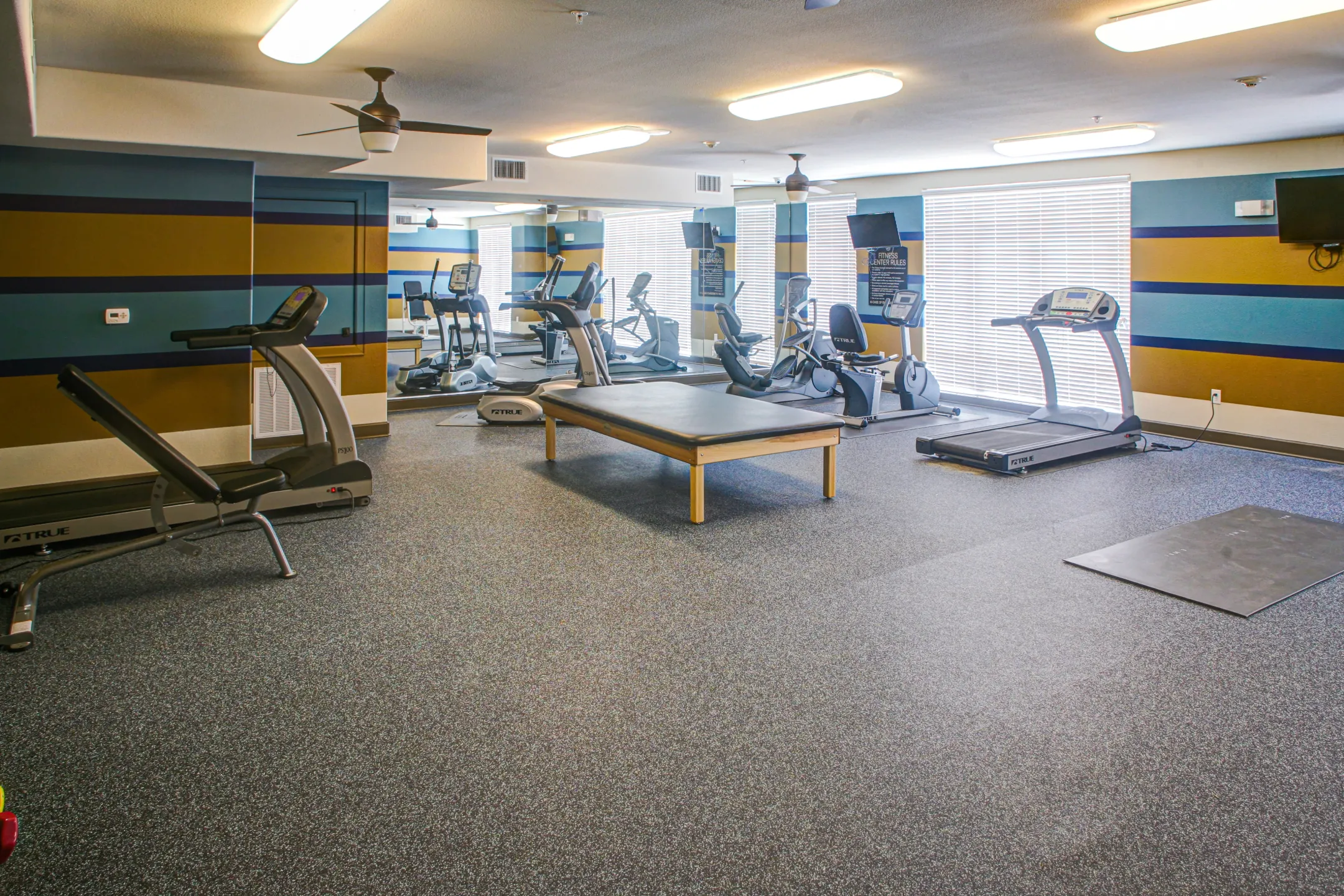 Fitness Weight Room - Highland Villas Apartments - Bryan, TX