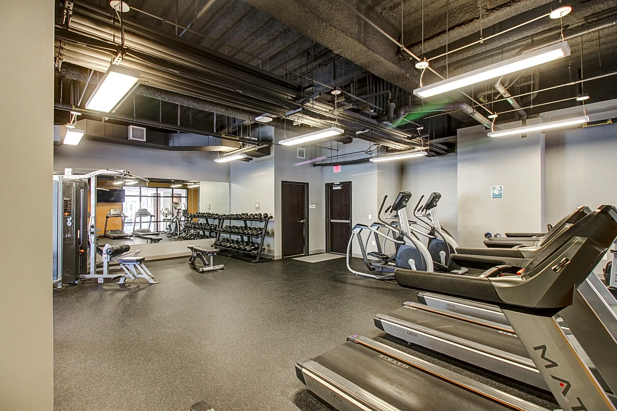 Fitness Weight Room - Capitol District Apartments. - Omaha, NE