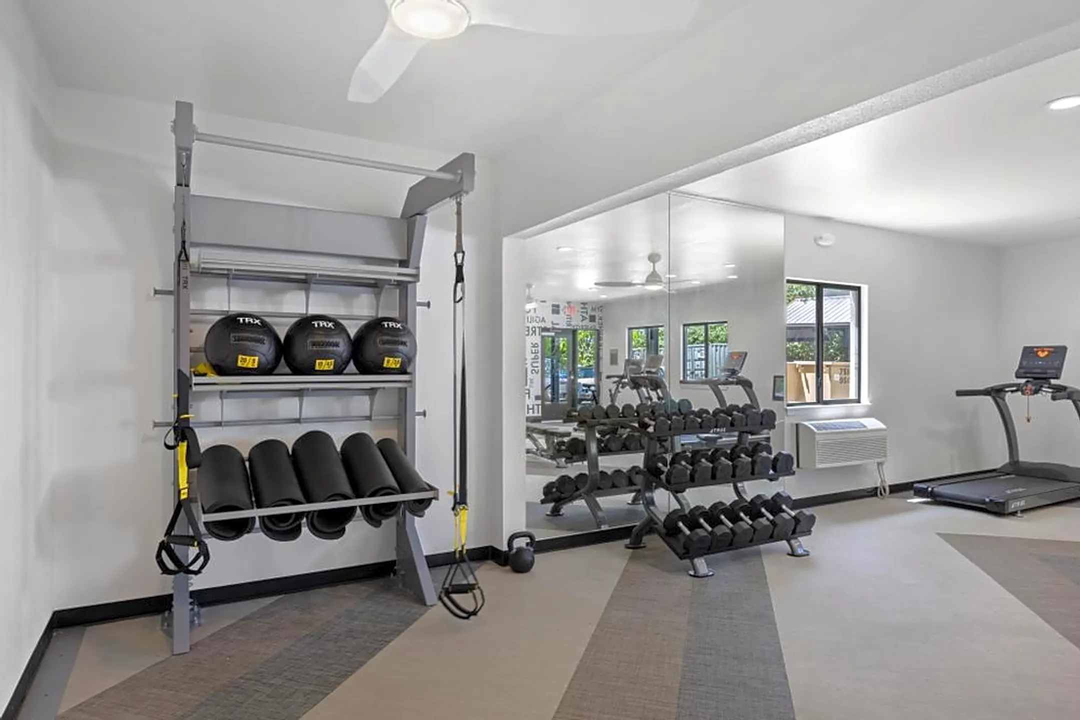 Fitness Weight Room - AVIA Apartments At College Boulevard - Overland Park, KS