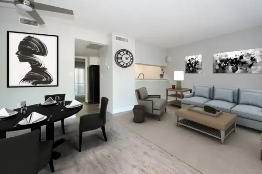 living room featuring a ceiling fan and refrigerator