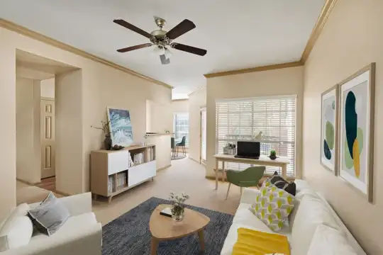 carpeted living room with natural light, a ceiling fan, and TV