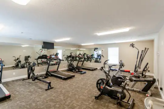 workout area featuring tile flooring and TV
