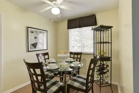 dining room featuring hardwood floors and a ceiling fan