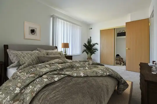 bedroom with carpet and natural light