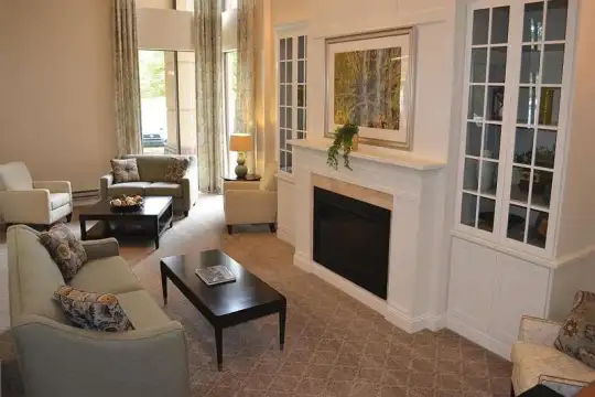 living room featuring carpet and a fireplace