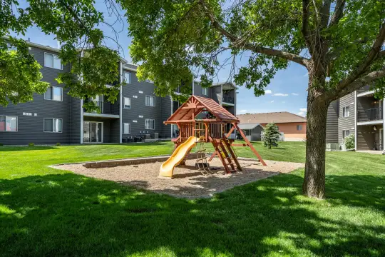 view of jungle gym featuring a large lawn