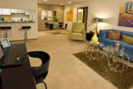 living room with carpet and a kitchen bar