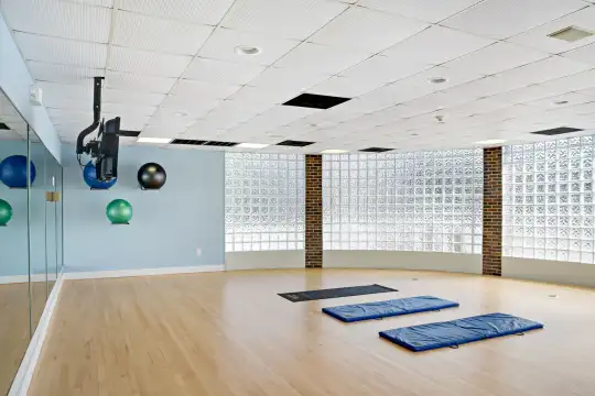 workout room featuring parquet floors