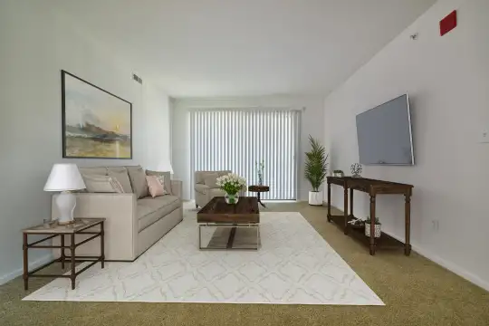 living room featuring natural light and TV