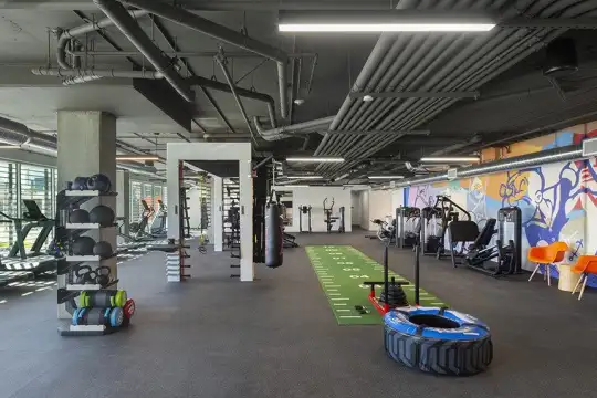 workout area with beamed ceiling