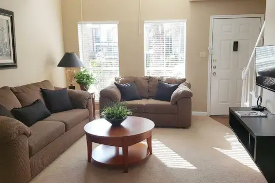 living room featuring natural light and TV