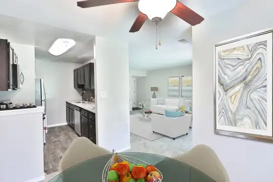 living room featuring a ceiling fan and microwave