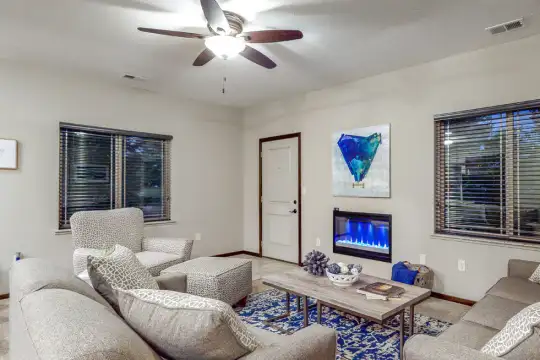 living room with a ceiling fan