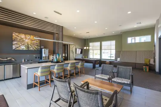 dining space with a healthy amount of sunlight, a breakfast bar area, and stainless steel finishes