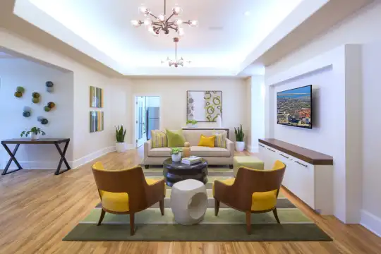 community lobby featuring parquet floors and TV