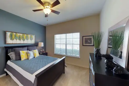 bedroom with vaulted ceiling, carpet, natural light, a ceiling fan, and TV