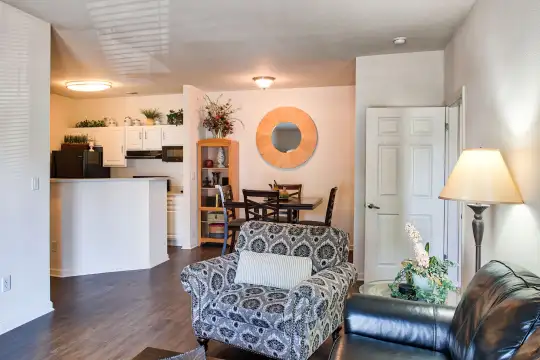 living room featuring hardwood floors, exhaust hood, and refrigerator