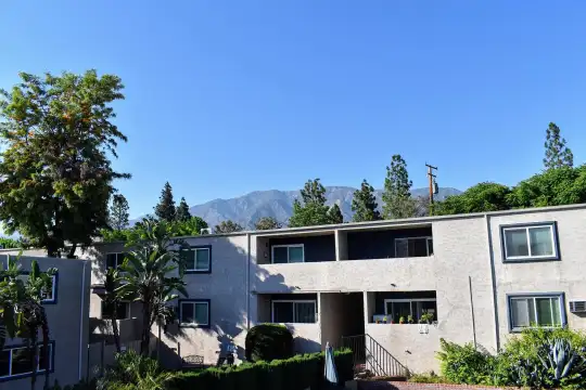 back of property featuring a mountain view