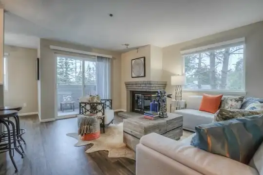living room with a healthy amount of sunlight and hardwood flooring