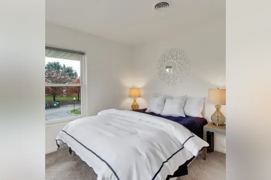 bedroom featuring carpet and natural light