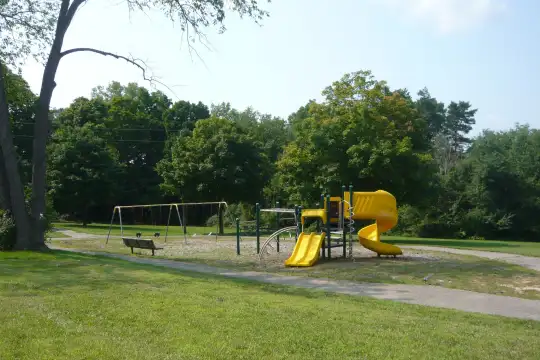 view of playground featuring a large lawn