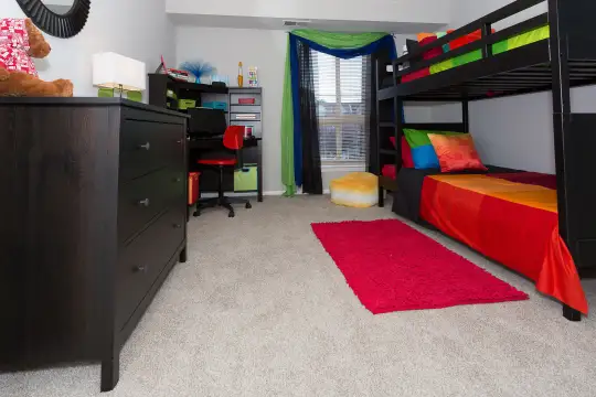 carpeted bedroom featuring natural light