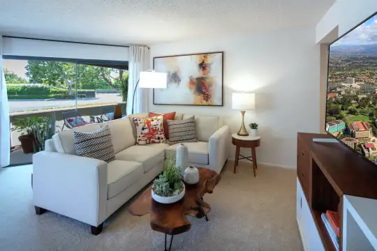 carpeted living room with a healthy amount of sunlight