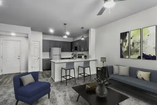 living room featuring carpet, a ceiling fan, a kitchen breakfast bar, refrigerator, microwave, and range oven