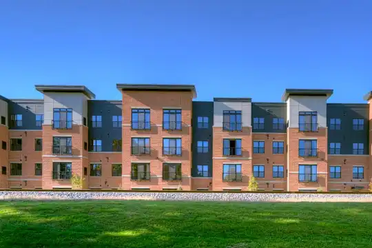 view of building exterior with a lawn