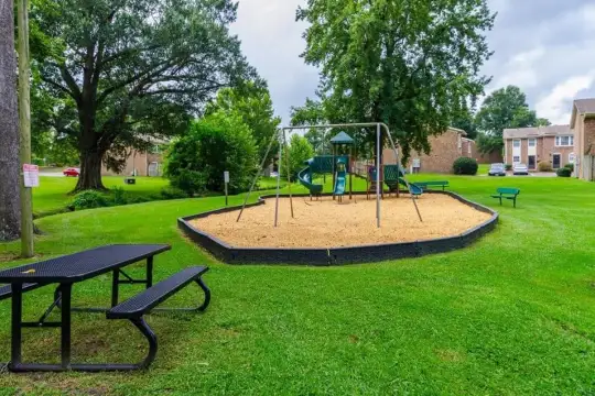 view of playground with a large lawn