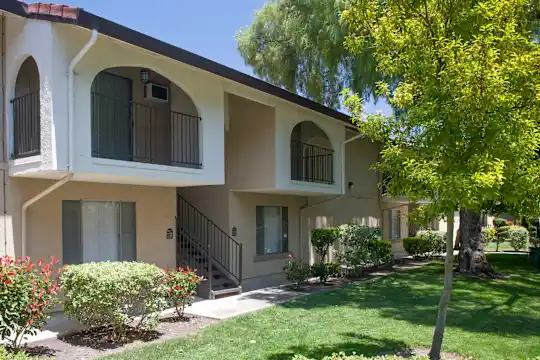 mediterranean / spanish home with a front lawn