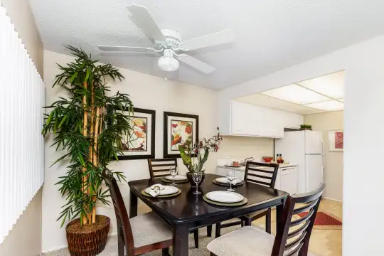dining area featuring a ceiling fan and refrigerator