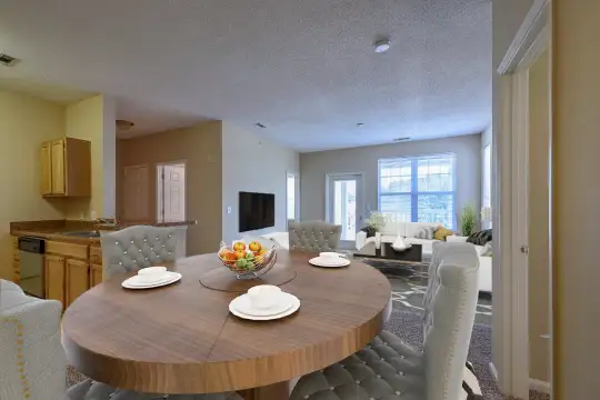 dining area featuring natural light, TV, and dishwasher