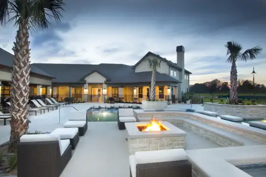 view of pool featuring fire pit
