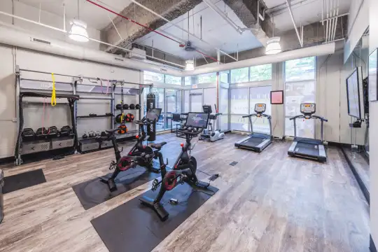 workout area featuring parquet floors