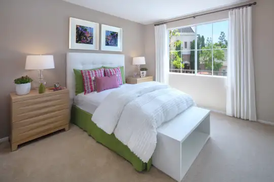 carpeted bedroom with natural light