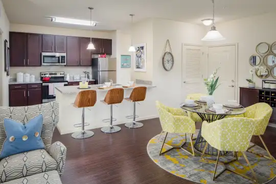 dining room featuring refrigerator, stainless steel microwave, and range oven