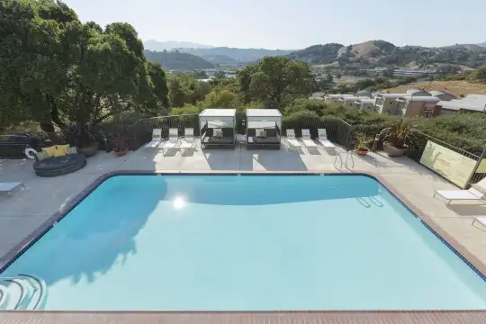 view of swimming pool with a mountain view