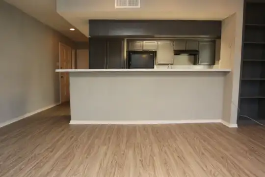 kitchen featuring white cabinets and light parquet floors