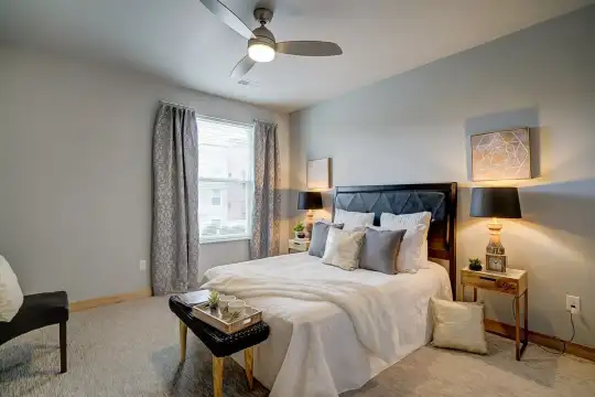 bedroom featuring natural light and a ceiling fan