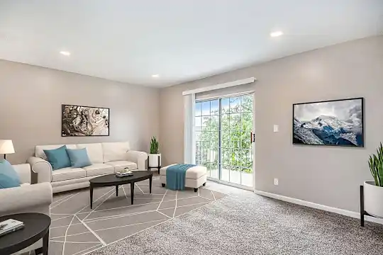 living room featuring carpet and natural light