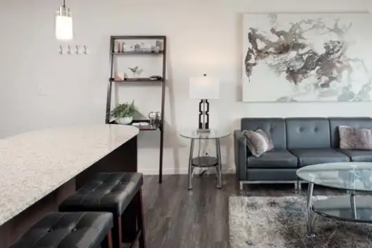 hardwood floored living room with a breakfast bar